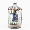 Schnapsflasche. Farbloses Glas, farbige Bemalung, Dame bzw. Herr. Min. berieben. H. 14 cm.