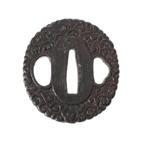 Tsuba. Japan. Eisen, Reliefdekor mit stilisierten Wellen. 6 x 5,4 cm.