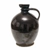 Henkelflasche (Blutzer). Kröning, Irdenware, schwarz-braun glasiert. Leicht besch. H. 30 cm.